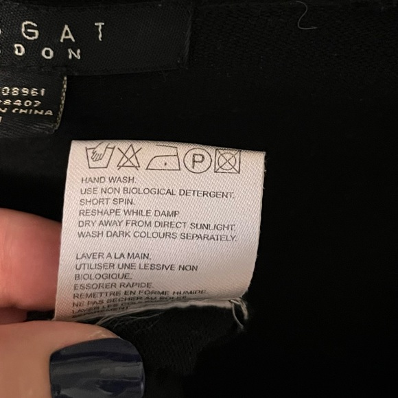 Light weight sweater with satin ribbon over chest, low cut and form fitting. - Picture 5 of 5